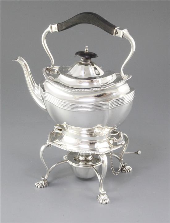 A silver kettle on stand, Height 11 ½”/290mm Width: 9”/230mm Weight 42.8oz/1213g.